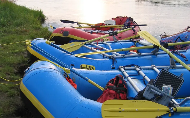inflatable rafts on the edge of a river