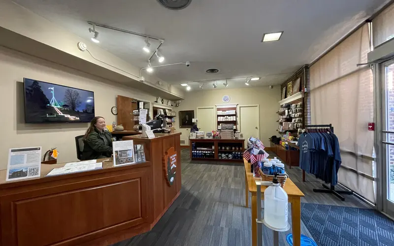 The entrance sidewalk to the Visitor Center with the Memorial Building in view