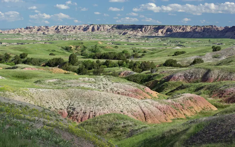 The yellow mounds are peaking out of the formations in this photo.