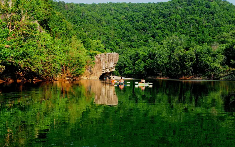 Kayakers floating towards Skull Rock near Buffalo Point.