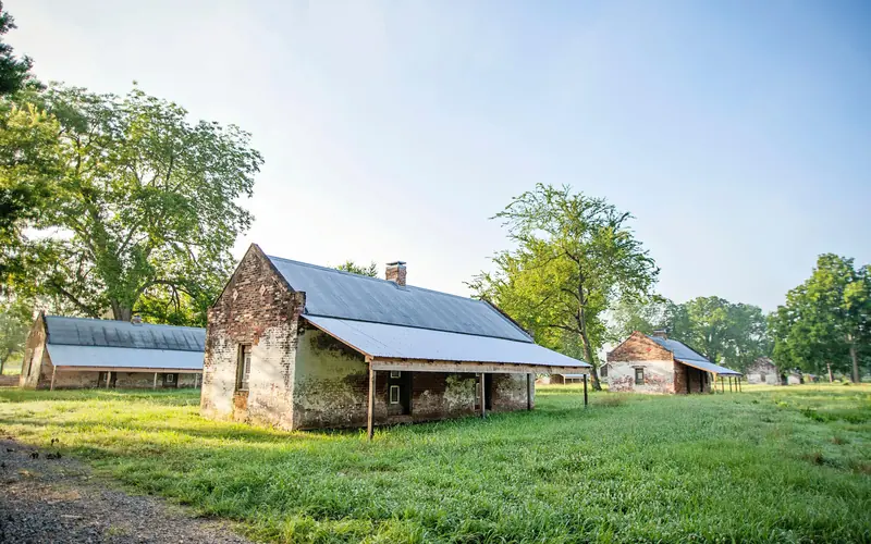Brick cabins built to house enslaved workers, served as homes for tenant farmers into the 1960s.