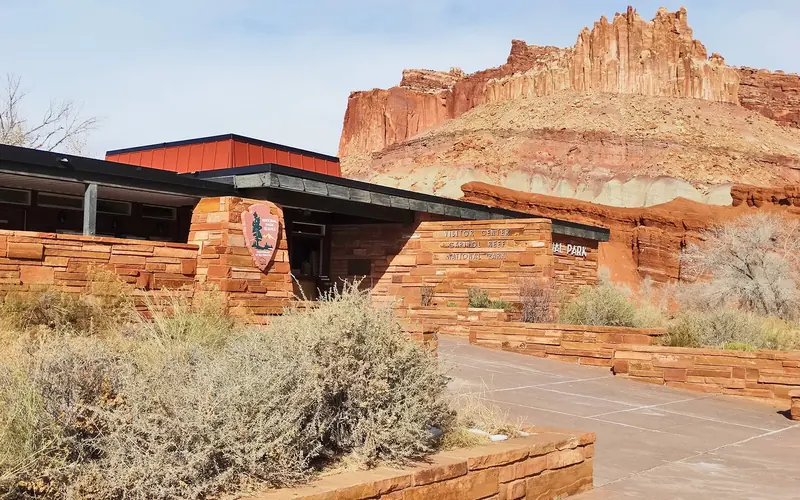 Cliffs known as "The Castle" tower above the Capitol Reef Visitor Center