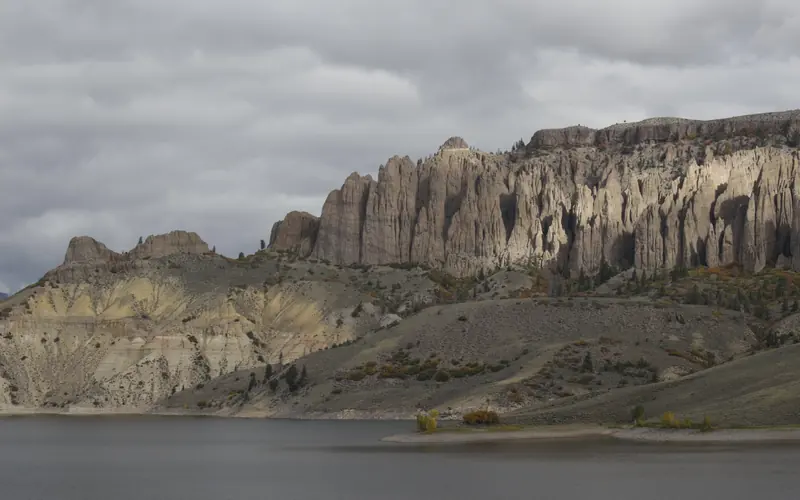 Large pinnacle spires across a body of water