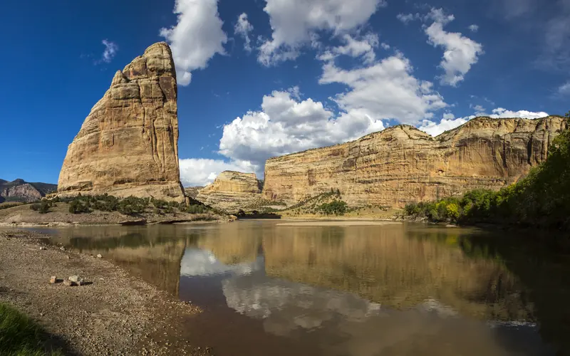 the rocky pinnacle of Steamboat Rock rises over the Green River