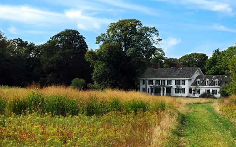 A view from a meadow of the historic Old Mastic House