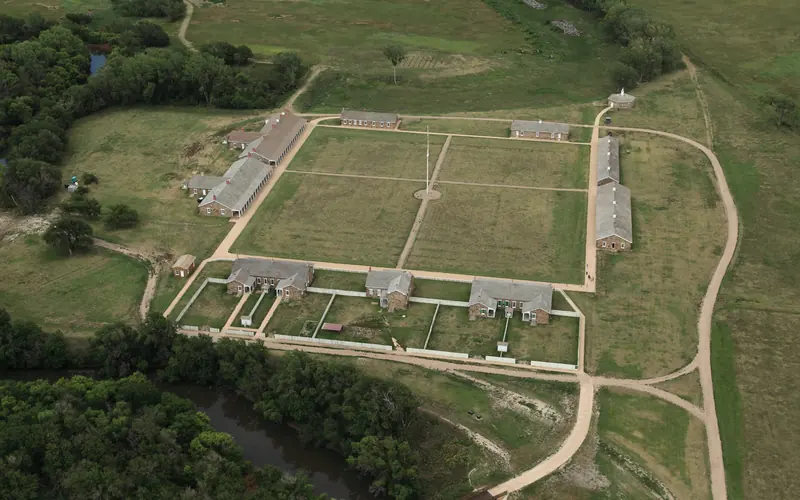 Sandstone army buildings arranged in a square around parade ground.