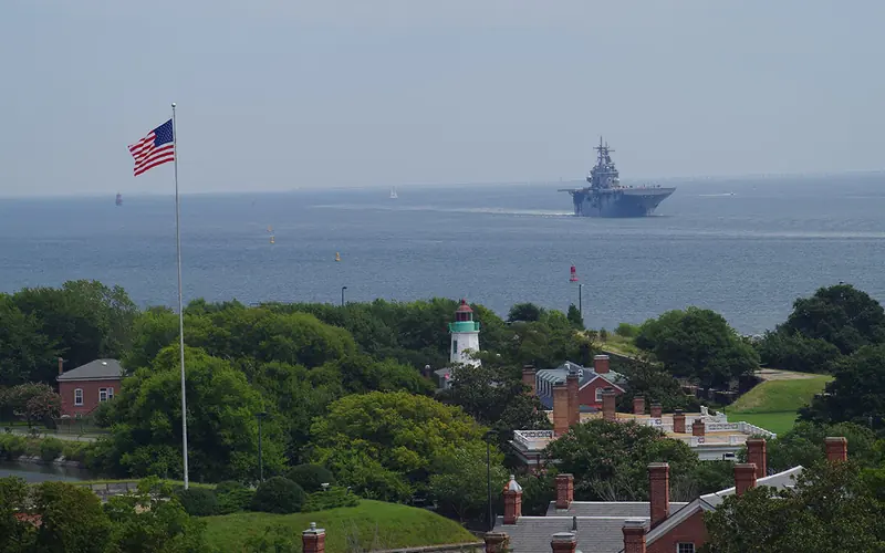 Fort Monroe in foreground with USS Kearsarge in background.