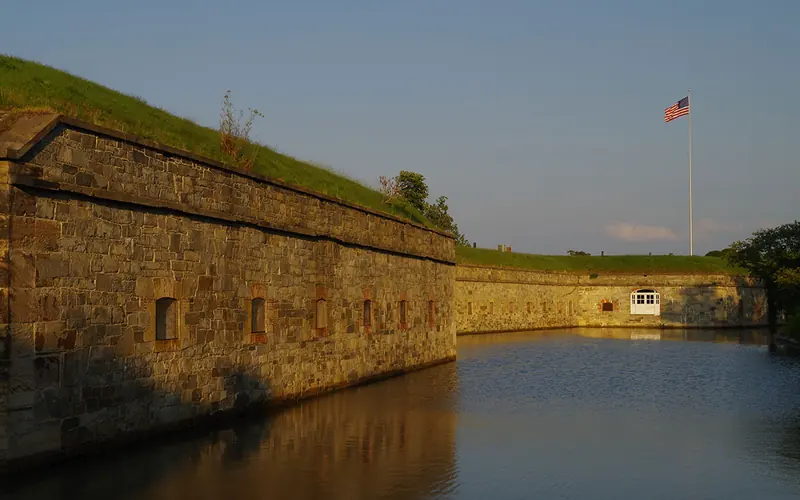 sun setting over the moat of Fort Monroe