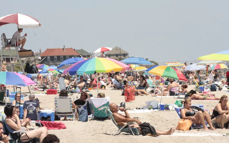 Visitors enjoying the sun and sand at Jacob Riis Park