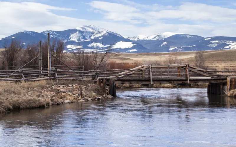 Deer Lodge Mountain rises up over the pastures of Grant-Kohrs Ranch National Historic Site.