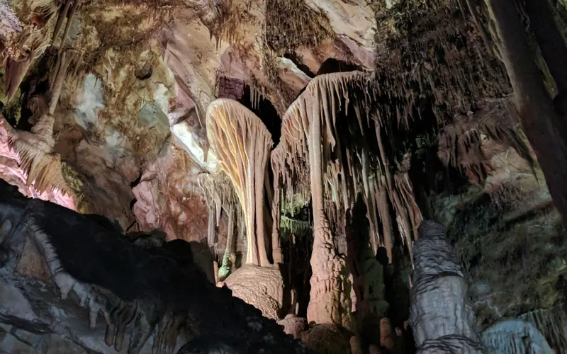 Brown and tan cave formation in the shape of a parachute