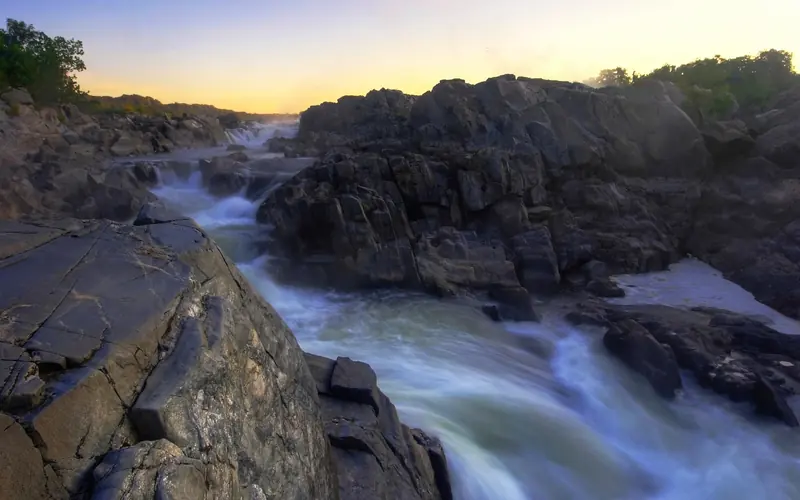 Great Falls with a purple sky near dusk