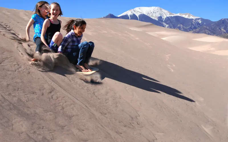 Girls Sand Sledding