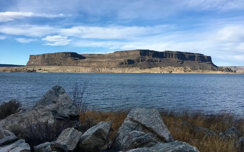 Large butte with lake in the foreground