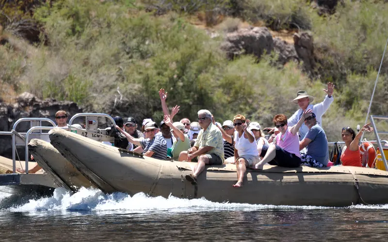 people on a tour operated craft exploring the lake.