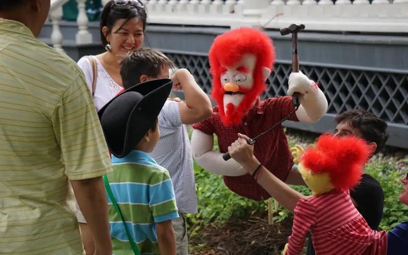 children interacting with puppet