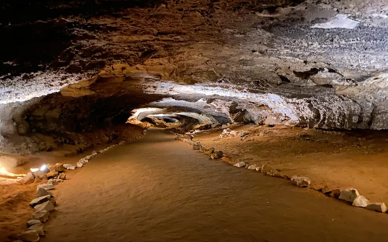 A long cave passage with an oval shape.