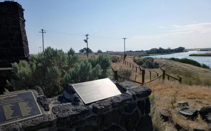 A view of the Northside Canal and reconstructed barbed wire fence.