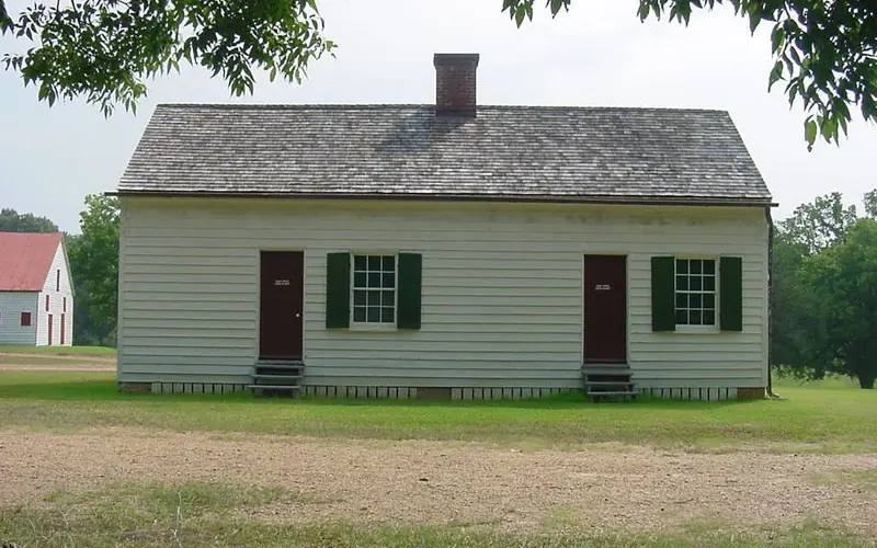 One story wood frame house with two doors and two windows