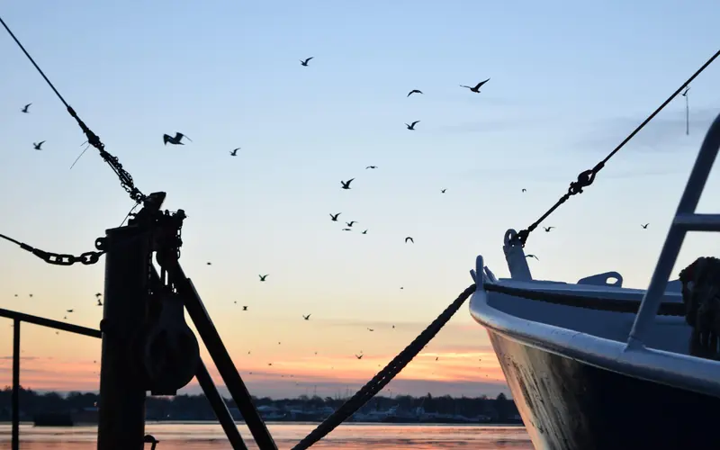 The sun setting over the Acushnet River in New Bedford.
