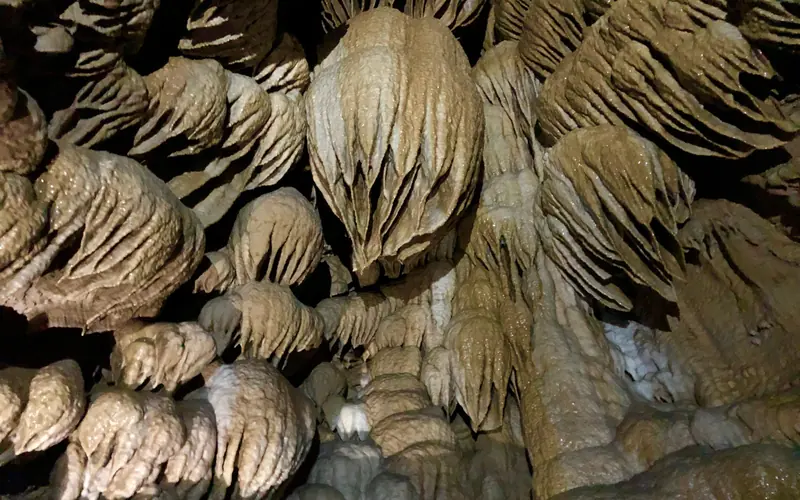 Flowstone and drapery in a dome pit