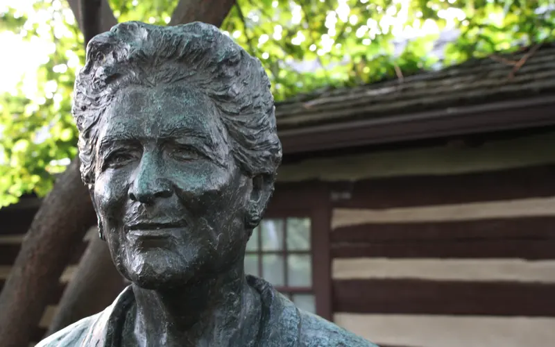 Bust of Catherine Filene Shouse with building in back